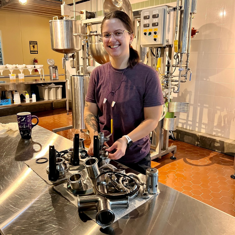 Brewer cleaning pilot brewery.