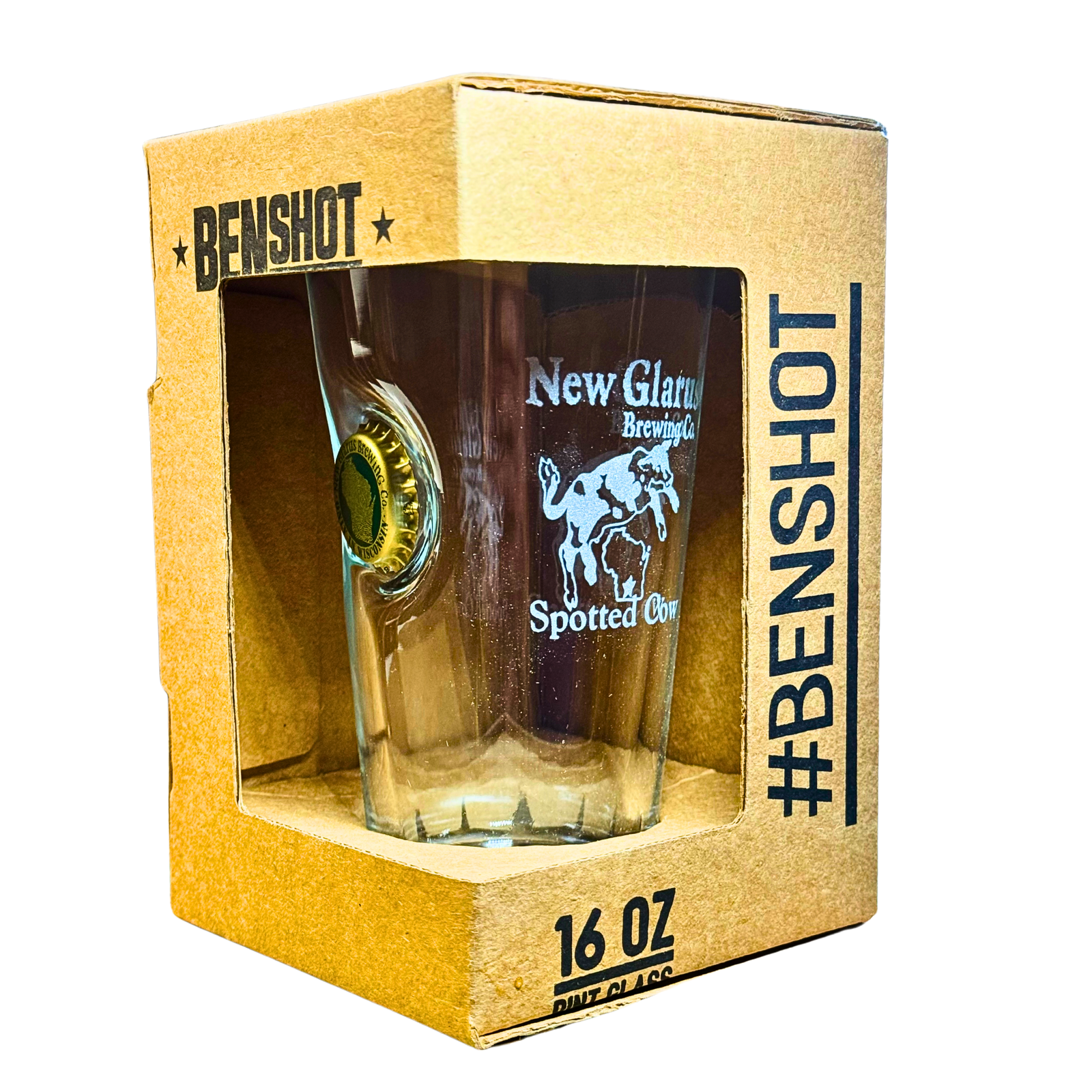 Pre-packaged 16oz pint shaker glass with etching of Spotted Cow logo in white. Embedded with a New Glarus Brewing bottlecap on the side.