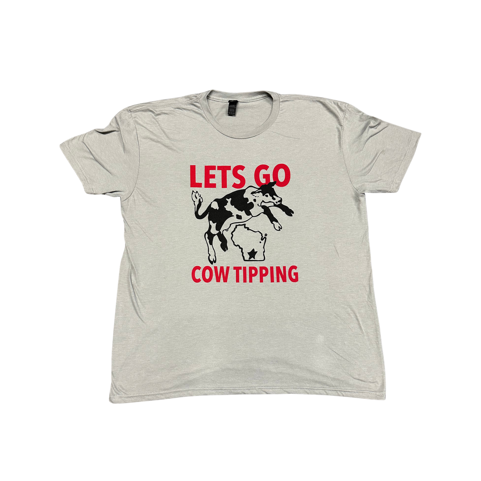 Light gray New Glarus Brewing Co. T-shirt featuring a black-and-white cow tipping over a Wisconsin-shaped outline, with red “LETS GO COW TIPPING” text above and below the graphic.