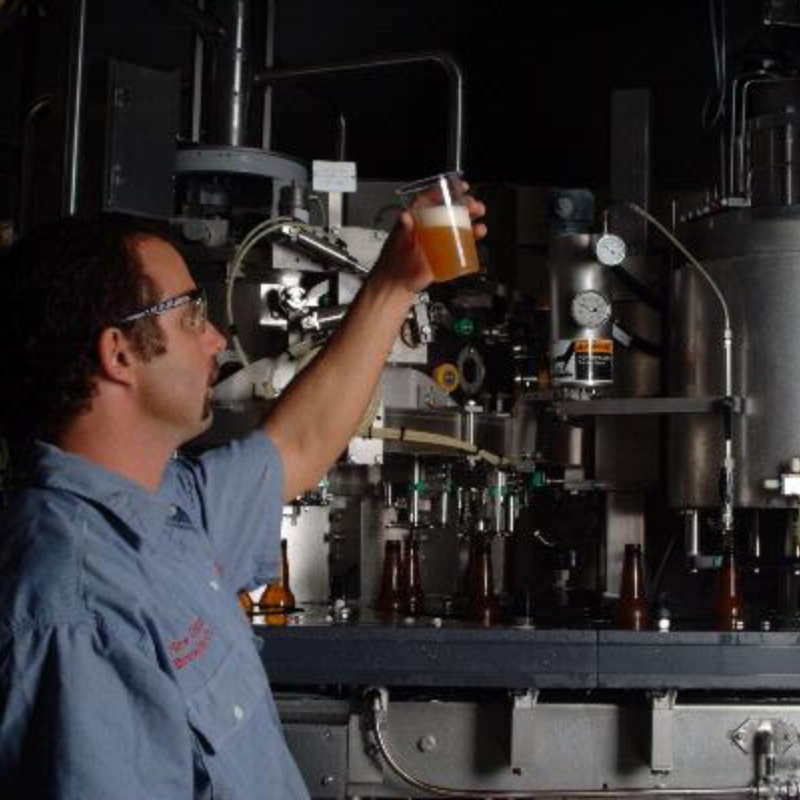 Brewer checking out clarity in beer