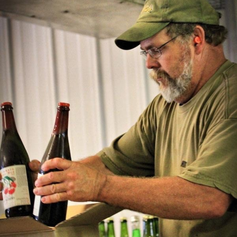 Brewer packaging Belgian Red bottles.