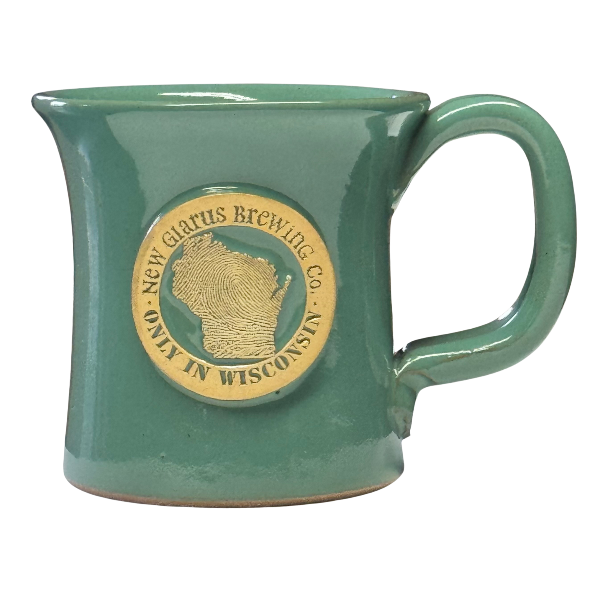 Jade colored pottery mug, with New Glarus Brewing Co. Only in Wisconsin medallion in cream n front