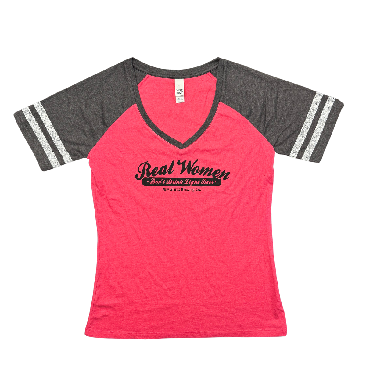 District ladies V-neck baseball tee, pink with charcoal sleeves. With New Glarus Brewing Co.&#39;s Real Women logo on front in black.