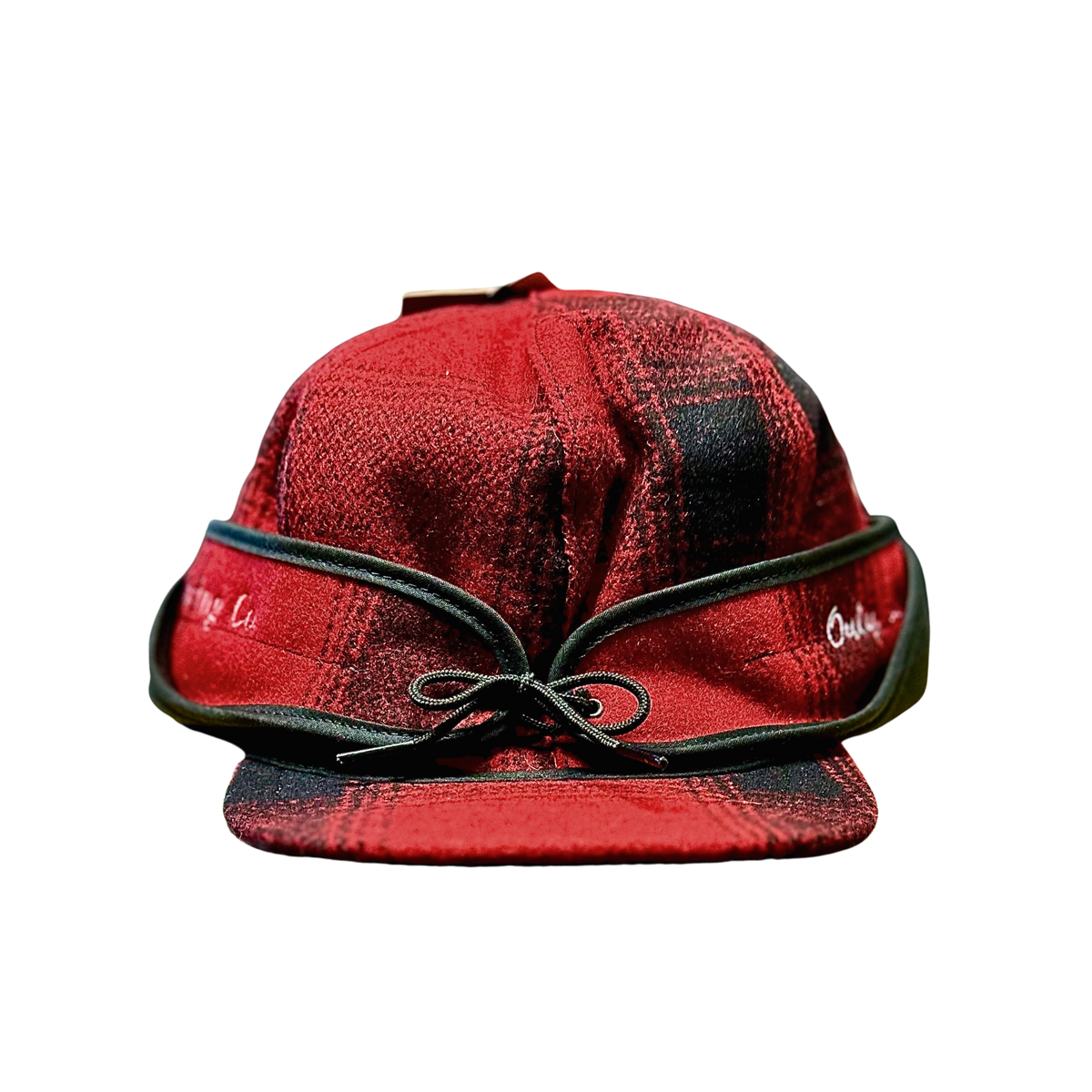 Stormy Kromer Hat in red and black plaid with New Glarus Brewing Co. stitched in white on left side, and Only in Wisconsin stitched in white on right side.