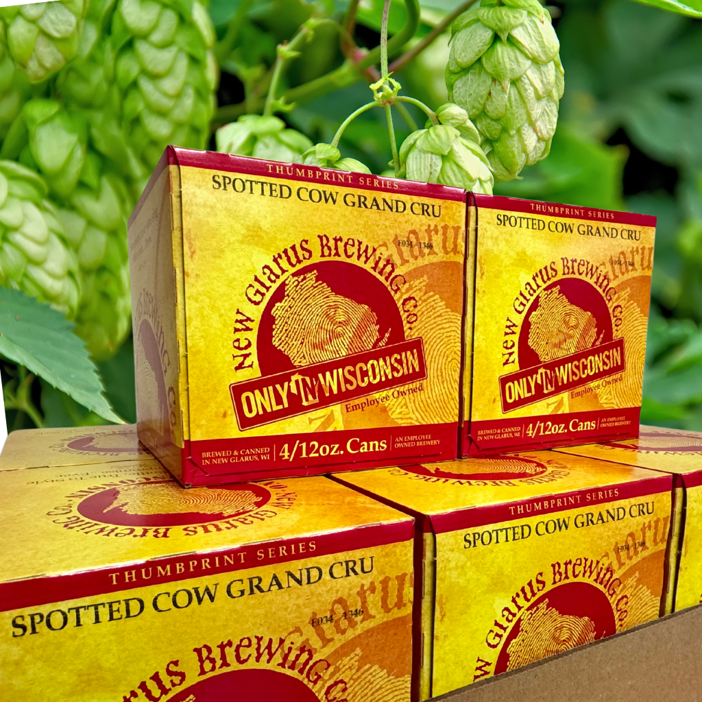 Thumbprint cans in front of hops background