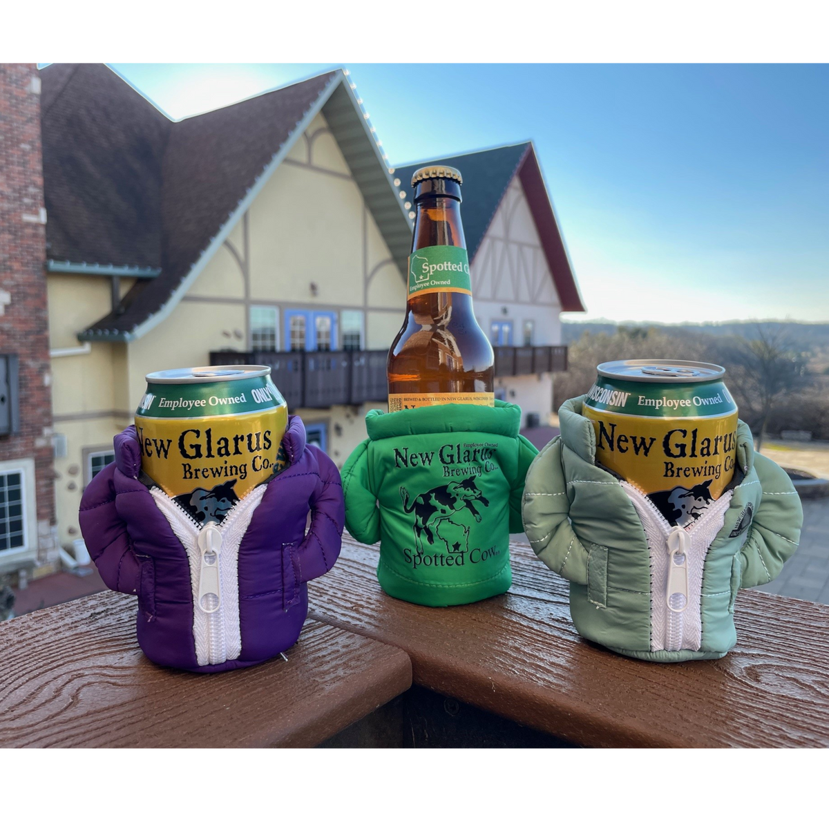 Three jacket coozies with one holding a beer bottle and the others holding cans.
