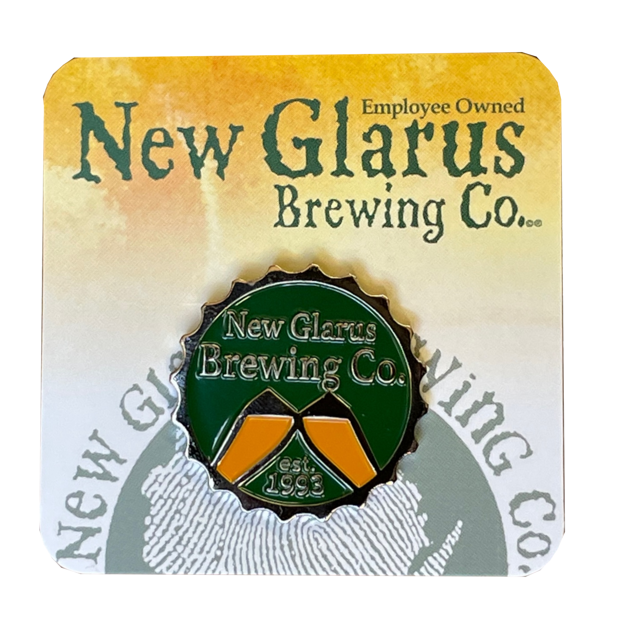 Bottle cap shaped circle green enamel pin with New Glarus Brewing Co. est. 1993 and two beer glasses clinking.