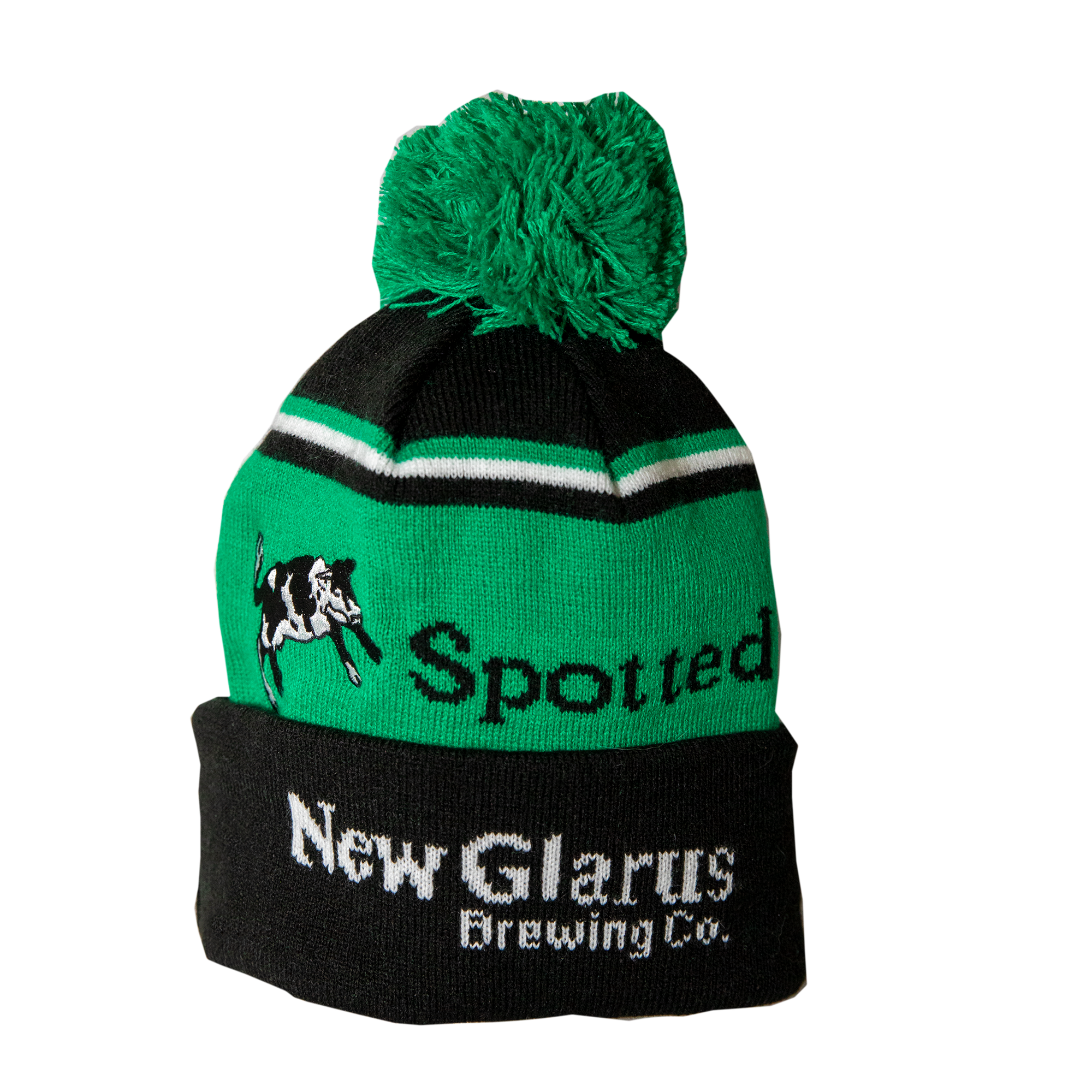 Green and black stocking hat with Spotted Cow and New Glarus Brewing Co. on it with a large green pom pom on top